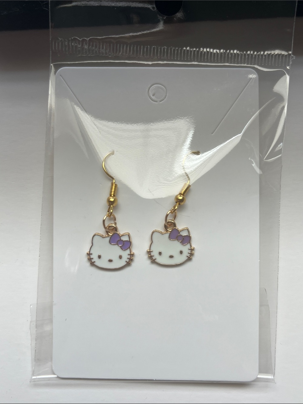 Hello Kitty Earrings with Purple Bows